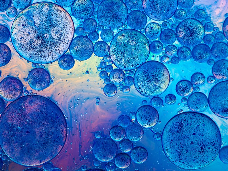 macro of interesting oil drops on water